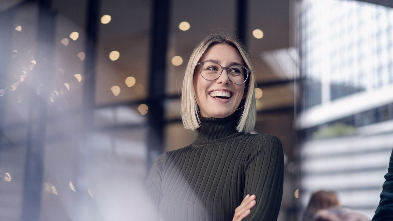 Blonde woman smiling in the office