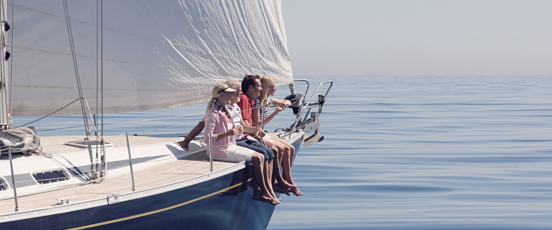 Family sitting on a sailboat